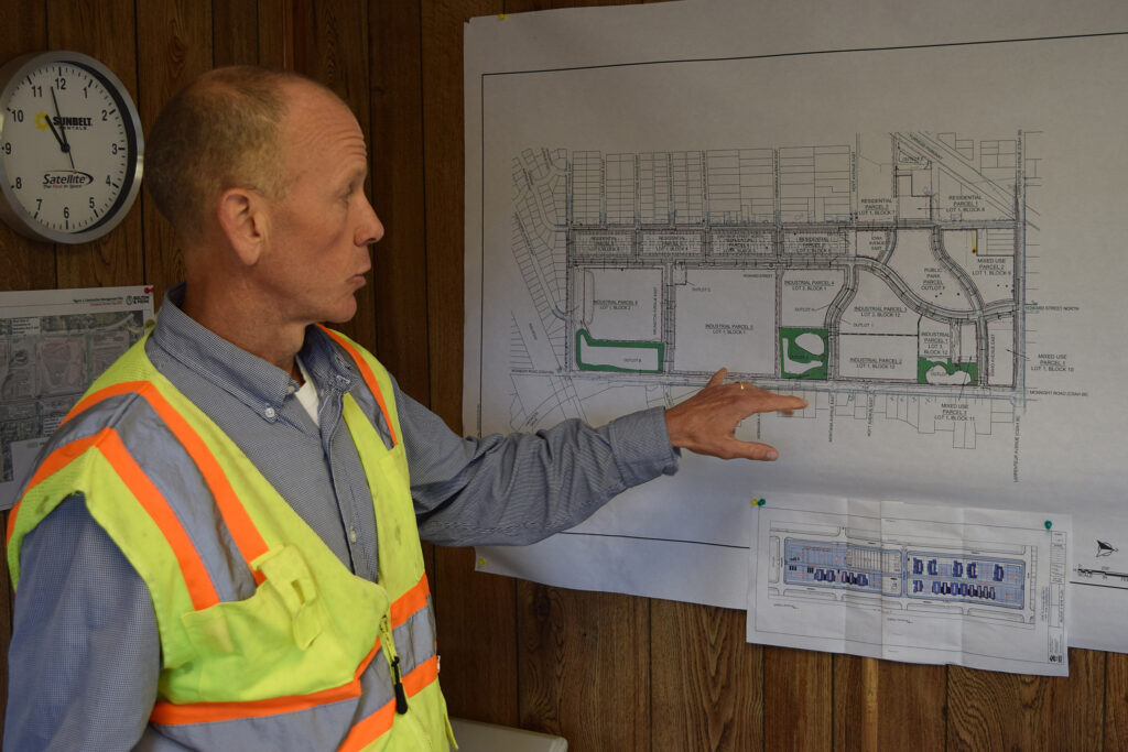 Michael Ahern describes the site plan for The Heights in St. Paul. The mixed-use development will tap an underground aquifer for heating and cooling. Credit: Phil McKenna/Inside Climate News