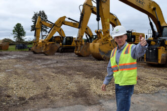 Michael Ahern, senior vice president for system development at Ever-Green Energy, describes where wells will be drilled at The Heights, a 112-acre mixed-use development currently under construction in St. Paul, Minn. Credit: Phil McKenna/Inside Climate News