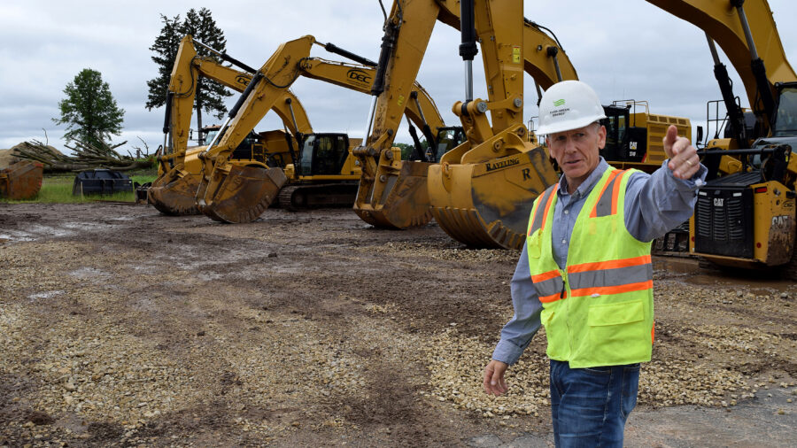 Michael Ahern, senior vice president for system development at Ever-Green Energy, describes where wells will be drilled at The Heights, a 112-acre mixed-use development currently under construction in St. Paul, Minn. Credit: Phil McKenna/Inside Climate News