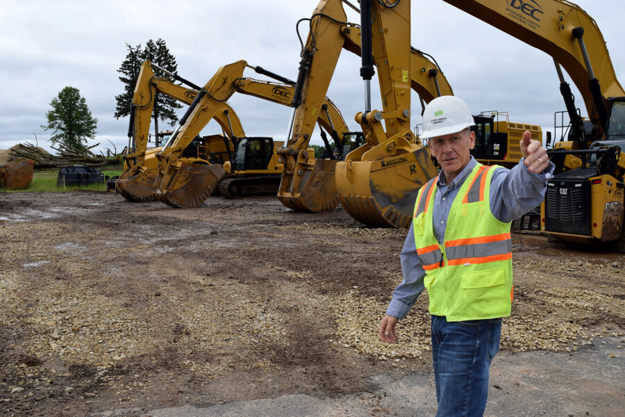 Michael Ahern, senior vice president for system development at Ever-Green Energy, describes where wells will be drilled at The Heights, a 112-acre mixed-use development currently under construction in St. Paul, Minn. Credit: Phil McKenna/Inside Climate News