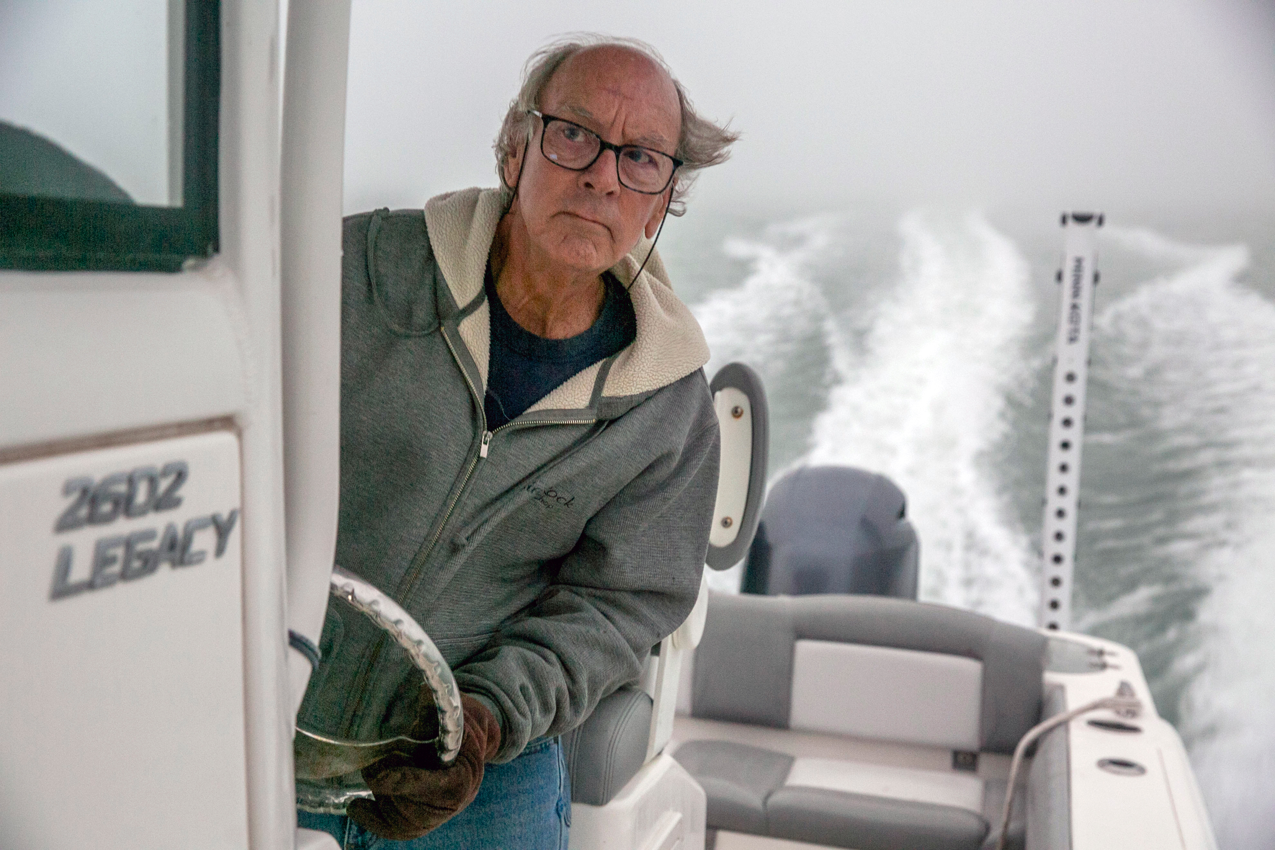 Patrick Nye pilots his boat on Corpus Christi Bay near Ingleside at daybreak on Dec. 7. Credit: Dylan Baddour/Inside Climate News