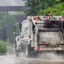 A truck for Noble Environmental, the parent company of Westmoreland Sanitary Landfill in Belle Vernon, Pa., drives down a road on a rainy day. Credit: Scott Goldsmith/Inside Climate News