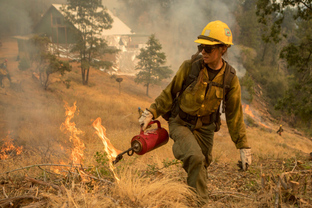 A Tahoe Hotshot uses a drip torch during a burn operation during the Ferguson Fire in California’s Sierra National Forest in 2018. Credit: Kari Greer/U.S. Forest Service