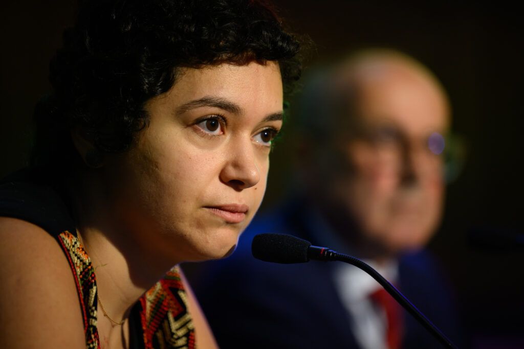 Hala Sabbah, co-founder of The Sameer Project, addresses Britain’s Gaza Tribunal on Sept. 4 in London. Credit: Leon Neal/Getty Images