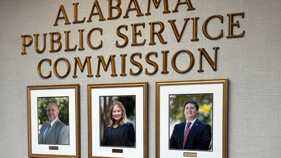 Photos of current Alabama Public Service Commissioners hang in the PSC offices. Chris Beeker (right) lost his reelection bid against Republican opponent Jim Zeigler. Credit: Dennis Pillion/Inside Climate News