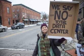 Rural Michigan residents rally this month against the $7 billion Stargate data center planned on southeast Michigan farm land in Saline. Credit: Jim West/UCG/Universal Images Group via Getty Images