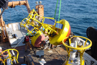 A NOAA ship retrieves a buoy from the Gulf of Maine. Credit: NOAA