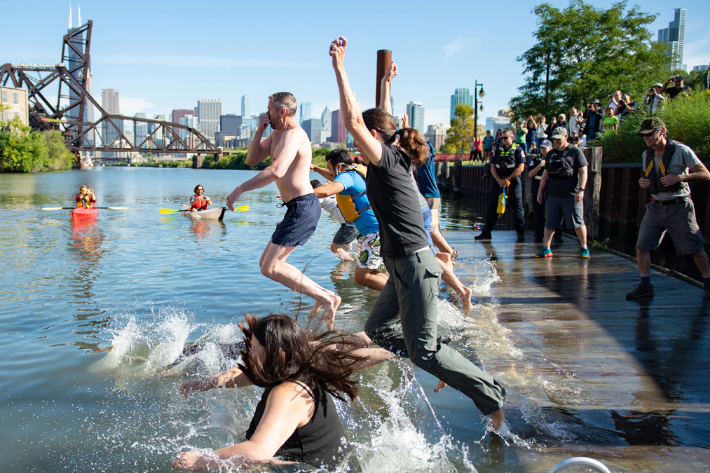 People jump into the south branch of the Chicago River. Credit: Courtesy of Dan Wendt
