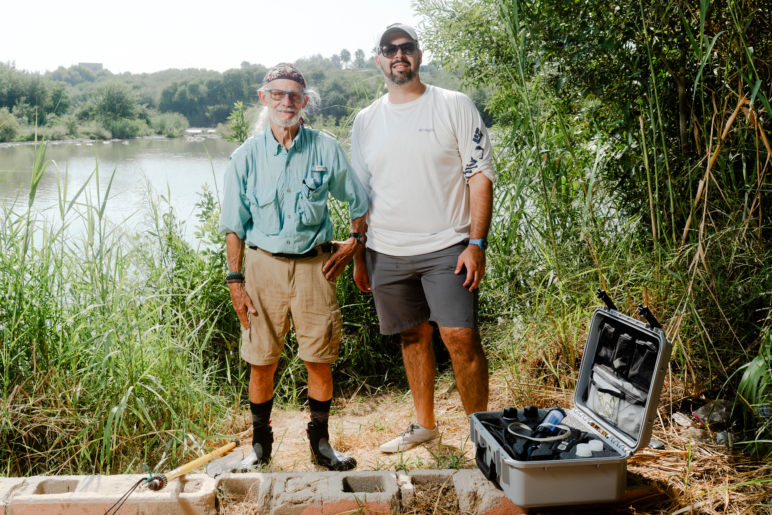 RGISC co-founder Tom Vaughan (left) and watershed science director Martin Castro stand on the banks of Zacate Creek in Laredo, Texas.