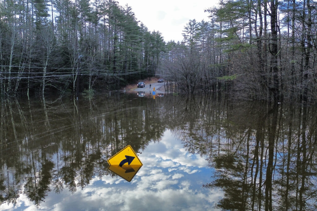 Route 232, one of the major highway corridors for western Maine, disappeared under floodwaters during the December 2023 storms. Credit: Courtesy of Oxford County Emergency Management Agency