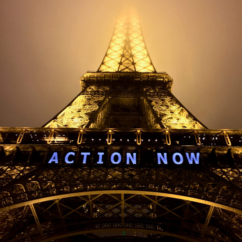 The Eiffel Tower is illuminated with a call for climate action during COP21 in Paris in 2015, when nations agreed to limit global warming under the science-based Paris Agreement, but greenhouse gas emissions have increased significantly since then.