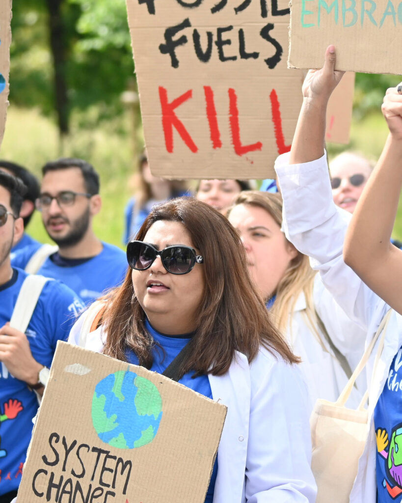 Farah Waseem participates in a demonstration on climate and health in Geneva. Waseem has engaged in climate activism since middle school. Credit: Courtesy of Farah Waseem