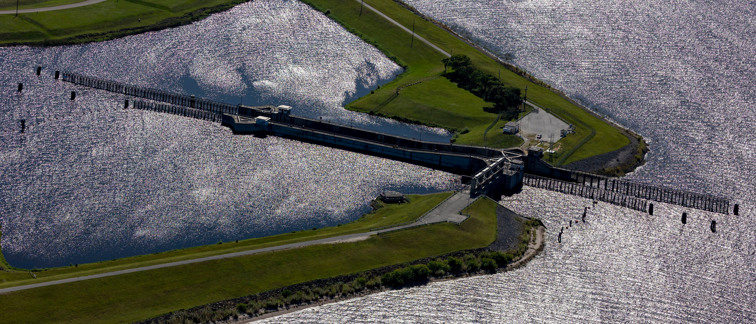 A lock and dam on Lake Okeechobee feeds the C-44 reservoir, an Everglades restoration project designed to spare the delicate estuary to the east of the lake of harmful nutrient pollution and toxic algae. Credit: Jose Iglesias/Miami Herald