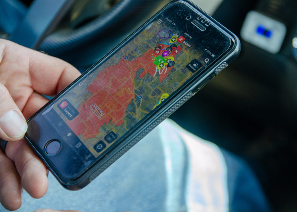 Jake Christian reviews 2024’s House Draw fire, which wiped out 90,000 acres of his property. Credit: Jake Bolster/Inside Climate News