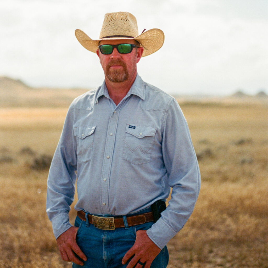 Jake Christian stands in the burn scar from 2024’s House Draw fire. Credit: Jake Bolster/Inside Climate News