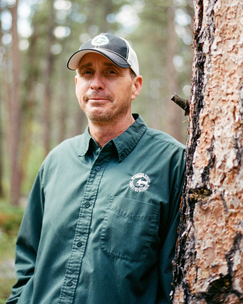 Jacob McCarthy stands near the Big Horn national forest. He wants more people to understand that fire is a natural process Wyomingites must learn to live with. Credit: Jake Bolster/Inside Climate News