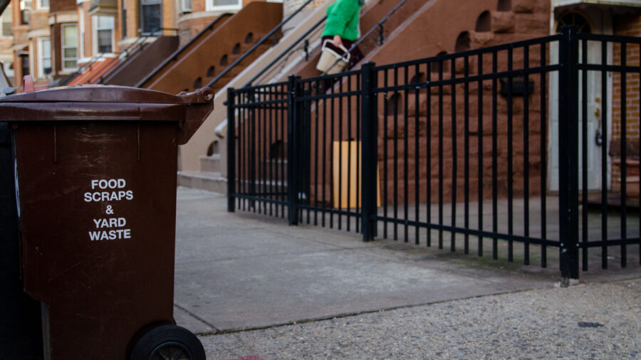 A compost bin sits outside a building in Queens, New York City. Credit: Jake Bolster/Inside Climate News