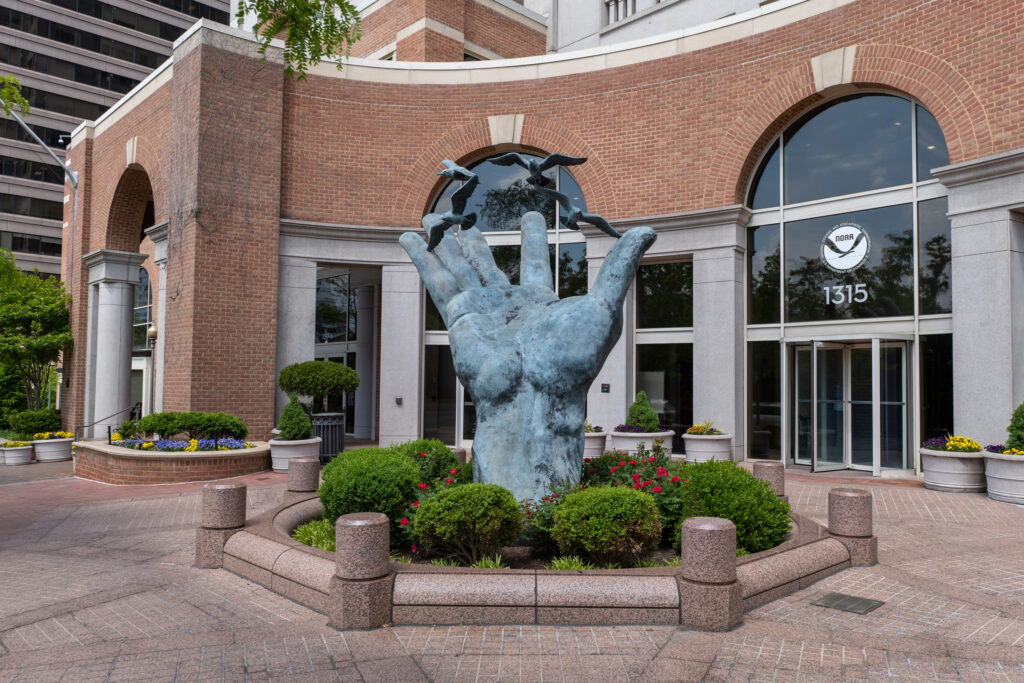 “The Hand of NOAA,” a sculpture created by Raymond Kaskey, sits outside NOAA’s Silver Spring, Md., headquarters. Credit: NOAA Heritage