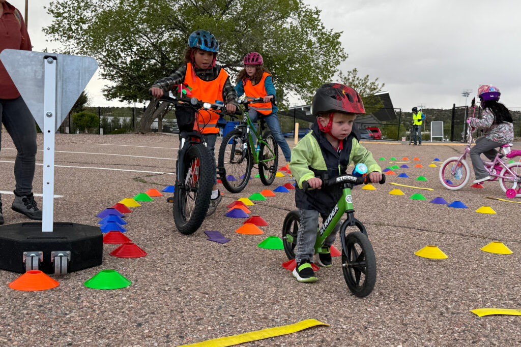 Kids learn traffic safety during a “bike rodeo” operated through the Safe Routes to School Program. Credit: Phil Lucero