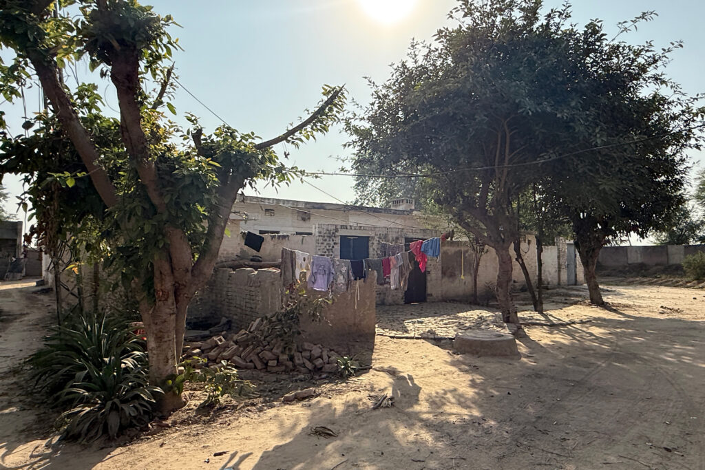 A view of a residential compound near the Sahiwal coal plant. Many homes here show signs of wear and long-standing neglect despite the industrial buildout around them. Aman Azhar/Inside Climate News
