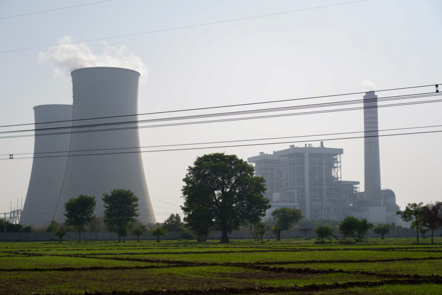 The cooling towers and main unit of the Chinese–funded Sahiwal coal plant dominate the skyline above rural farmlands in Punjab, Pakistan. Credit: Aman Azhar/Inside Climate News