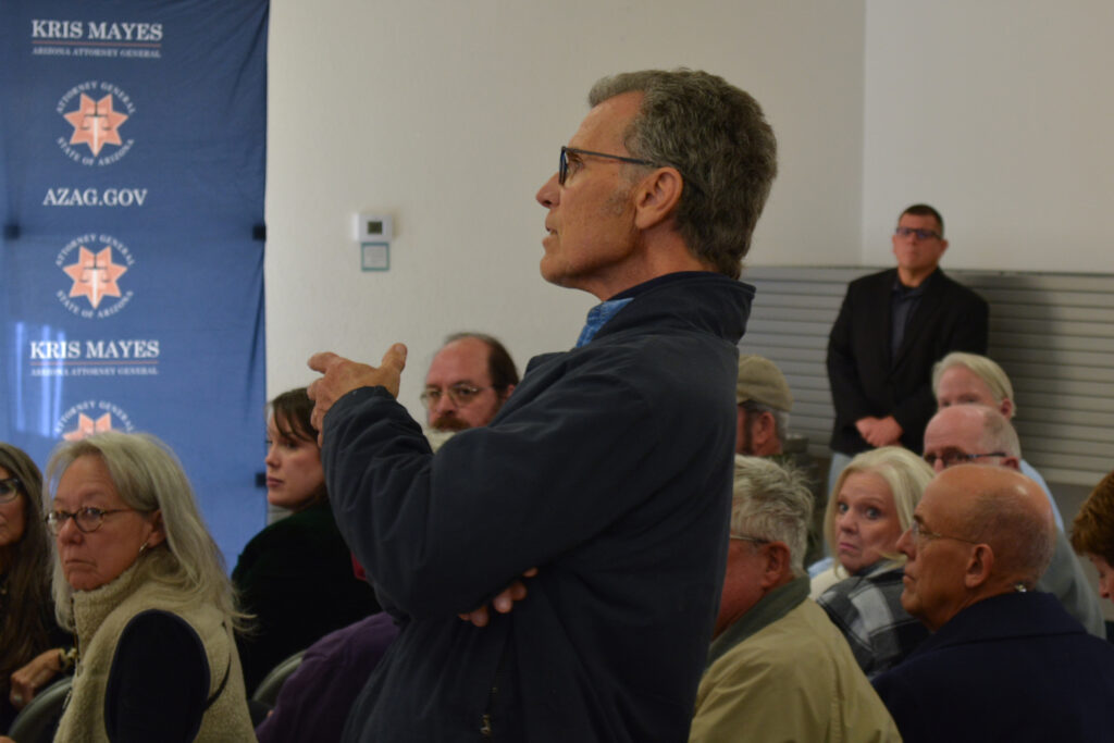 Steven Kisiel speaks at the town hall in Pearce, Ariz. Credit: Wyatt Myskow/Inside Climate News