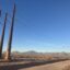 Transmission lines along Stan Roberts Sr. Avenue in Northeast El Paso, adjacent to the construction site of the Meta data center. The Franklin Mountains are visible in the background. Credit: Martha Pskowski/Inside Climate News