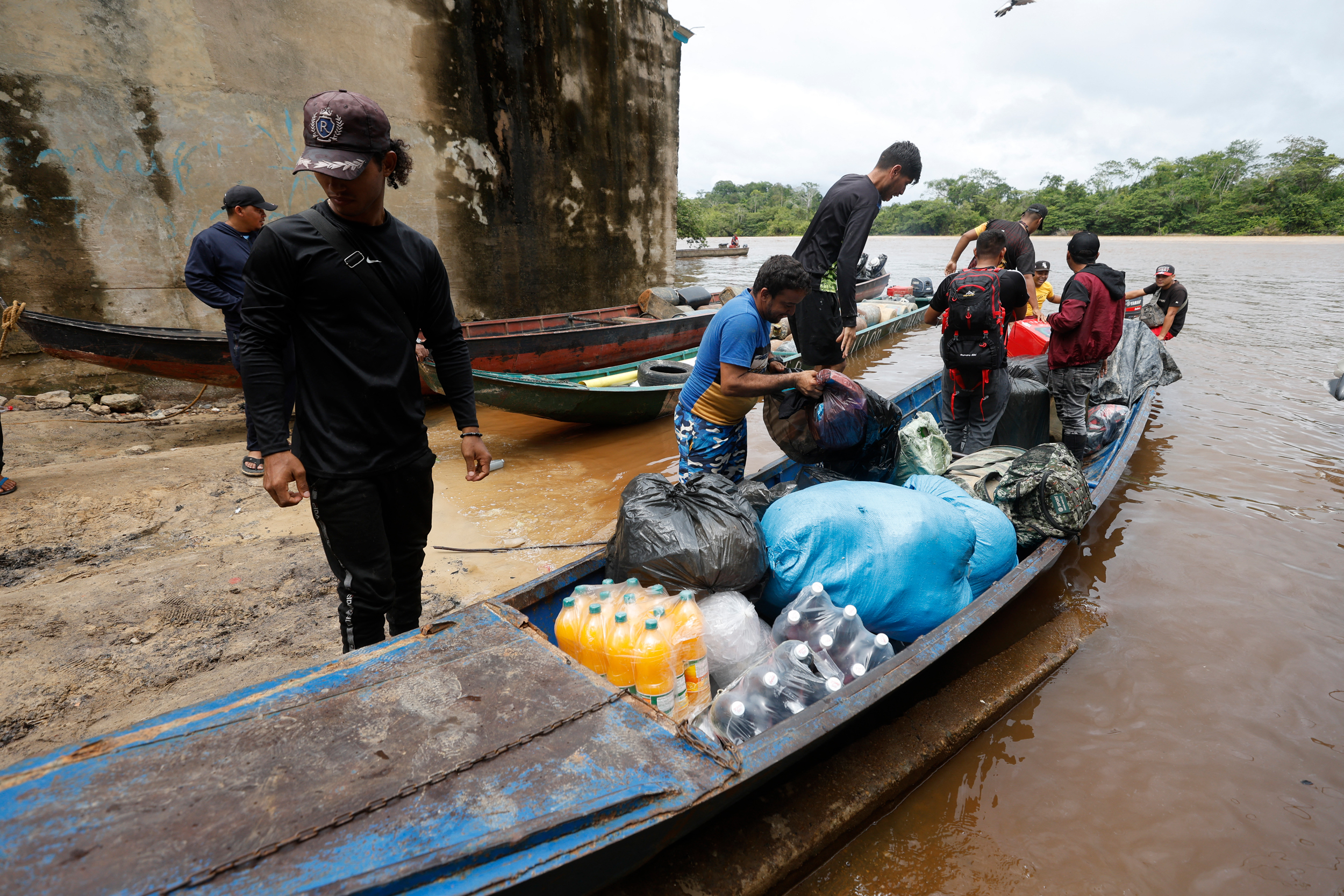 Mine workers prepare a boat to set sail in the mining town of El Dorado, Venezuela, on May 24, 2025. Credit: Pedro Mattey/AFP via Getty Images