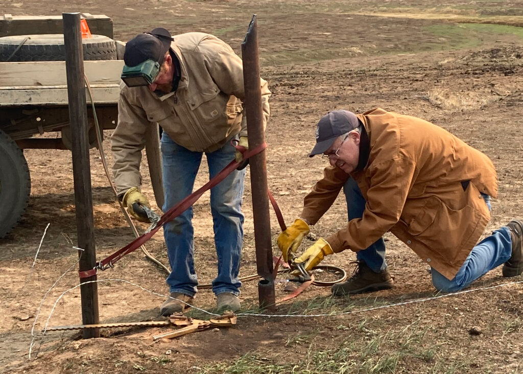 It took Jake Christian and his father close to a year to rebuild the burnt fenceline. Credit: Courtesy of Sara Christian