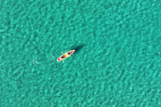 Boaters in a kayak off the coast of La Jolla Shores, California, in December 2025. Credit: Kevin Carter/Getty Images