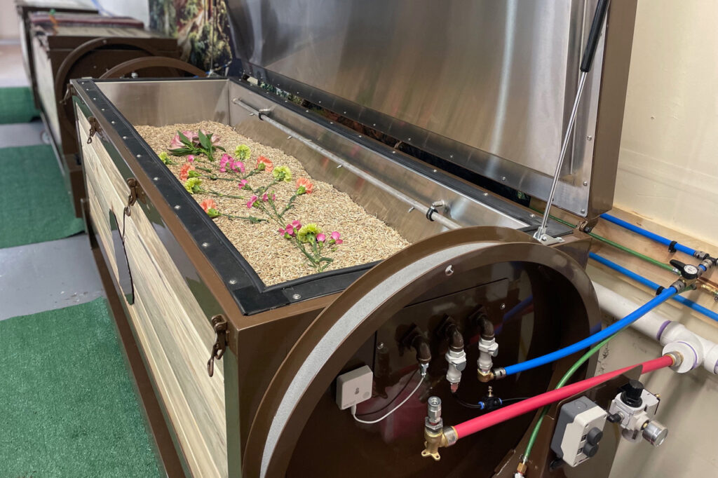 Chrysalis Vessels, patent-pending human composting machines at The Natural Funeral, with some of the materials that help compost human bodies. Credit: The Natural Funeral