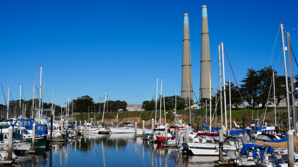 The Moss Landing Power Plant looms in the distance of a nearby marina. Credit: Claire Barber/Inside Climate News
