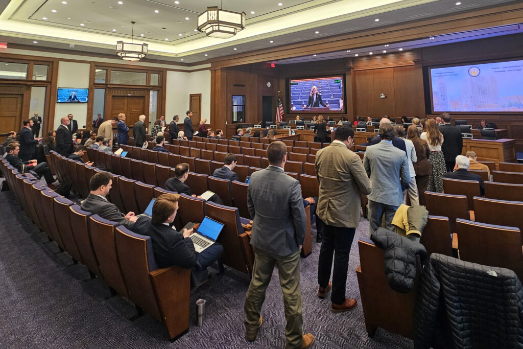 Lobbyists line up to speak on a data center tax exemption bill on Feb. 9. Credit: Charles Paullin/Inside Climate News