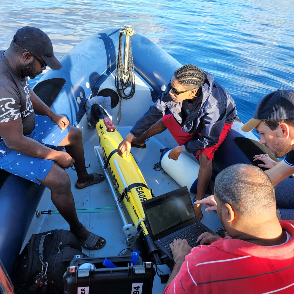 Project CETI’s team works with a “glider,” used by researchers to gather data by swimming alongside whales. Credit: Project CETI