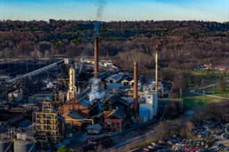 Smoke emits from the stacks of ABC Coke in Jefferson County, Alabama. Credit: Lee Hedgepeth/Inside Climate News
