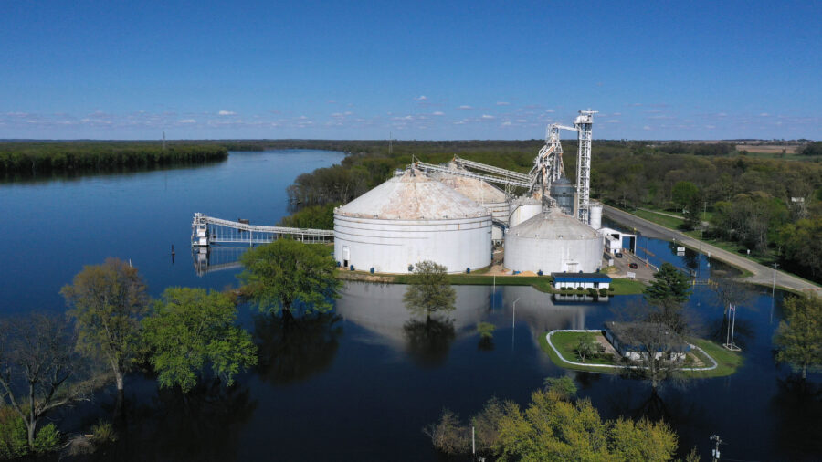 A grain elevator is surrounded by floodwater from the Mississippi River on the Iowa-Illinois border in 2023. Credit: Scott Olson/Getty Images