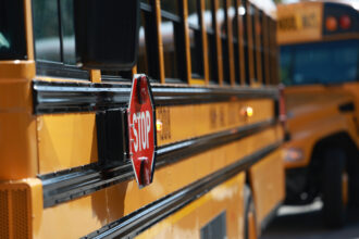 An electric school bus is parked at Coral Reef High School in Richmond Heights, Fla. Credit: Joe Raedle/Getty Images