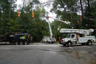 A Georgia Power crew works to remove trees from transmission lines in the wake of Hurricane Helene on Sept. 27, 2024, in Atlanta, Ga. Credit: Megan Varner/Getty Images