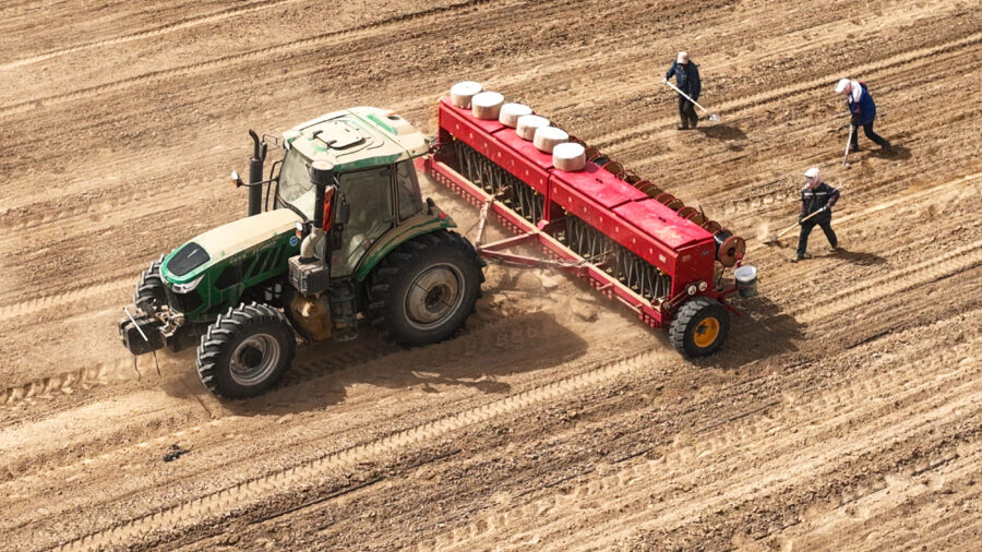 Farmers use a self-driving tractor to sow wheat on a farm in Zhangye, China. Credit: CFOTO/Future Publishing via Getty Images