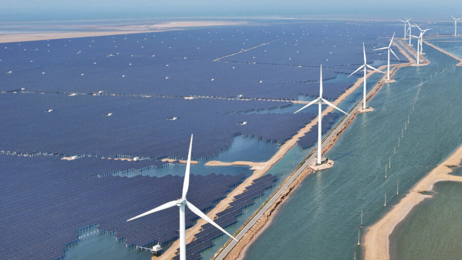 Solar panels and wind turbines are seen at the Huaneng Binzhou new energy power generation project in Binzhou, China, on June 11, 2025. Credit: STR/AFP via Getty Images