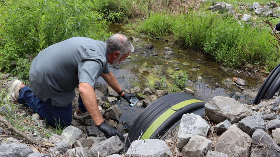 Water quality expert Bob Bowcock tests a creek for cancer-causing PFAS “forever chemicals” at a property in Dalton, Ga., on June 12, 2025. Credit: Issam Ahmed/AFP via Getty Images