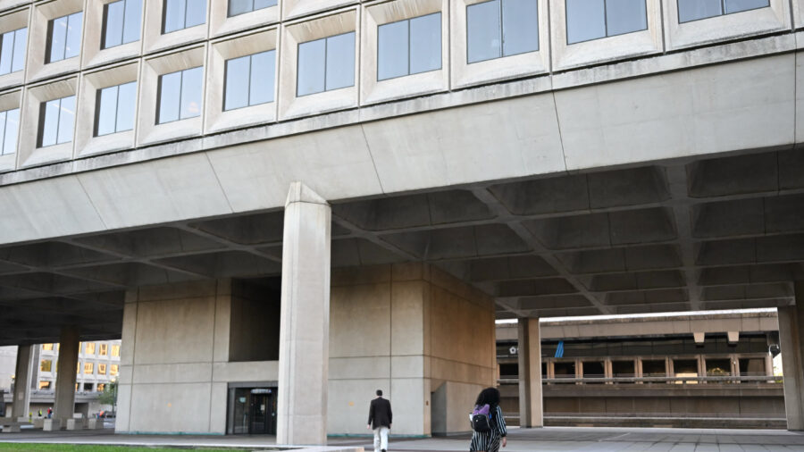 Employees walk into the U.S. Department of Energy building in Washington, D.C. Credit: Andrew Caballero-Reynolds/AFP via Getty Images