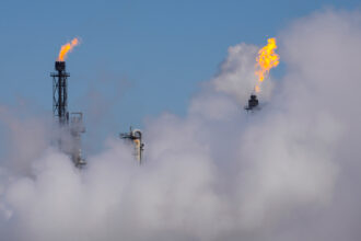 Steam rises from one of the plants near the Houston Ship Channel on Jan. 26 in Deer Park, Texas. Credit: Brett Coomer/Houston Chronicle via Getty Images