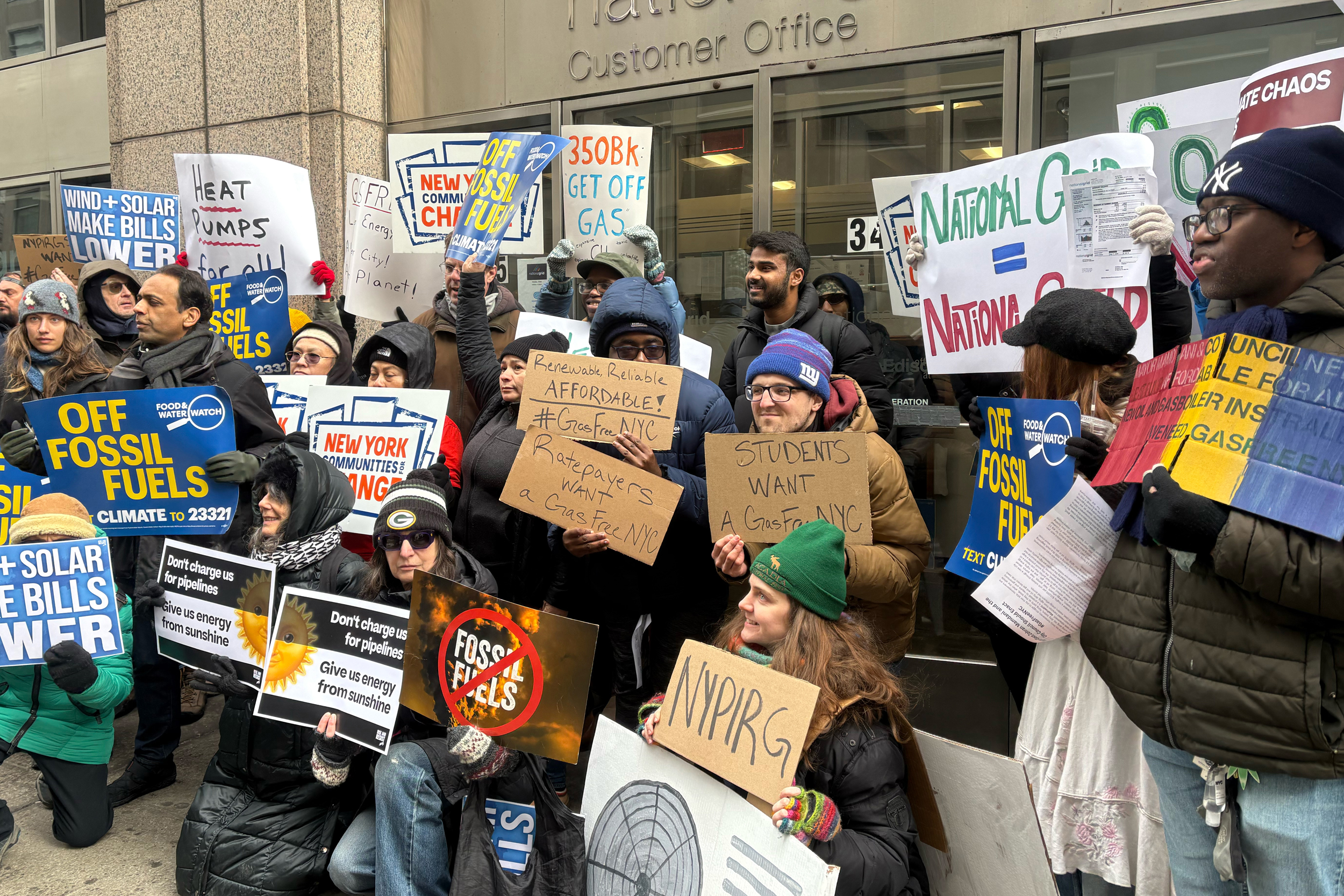 Activists advocate for New York City buildings to be less reliant on gas during a February protest in front of the National Grid office in Brooklyn. Credit: Lauren Dalban/Inside Climate News