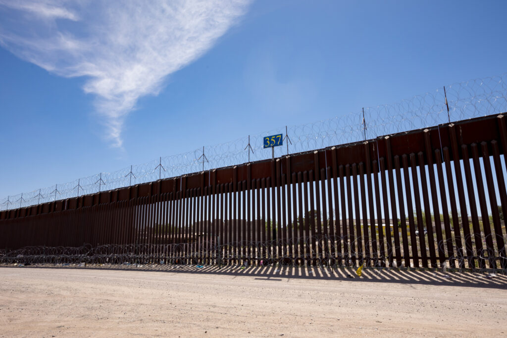 The border wall stretches along a dirt road near Sunland Park, N.M. Credit: Gaby Velasquez/Puente News Collaborative