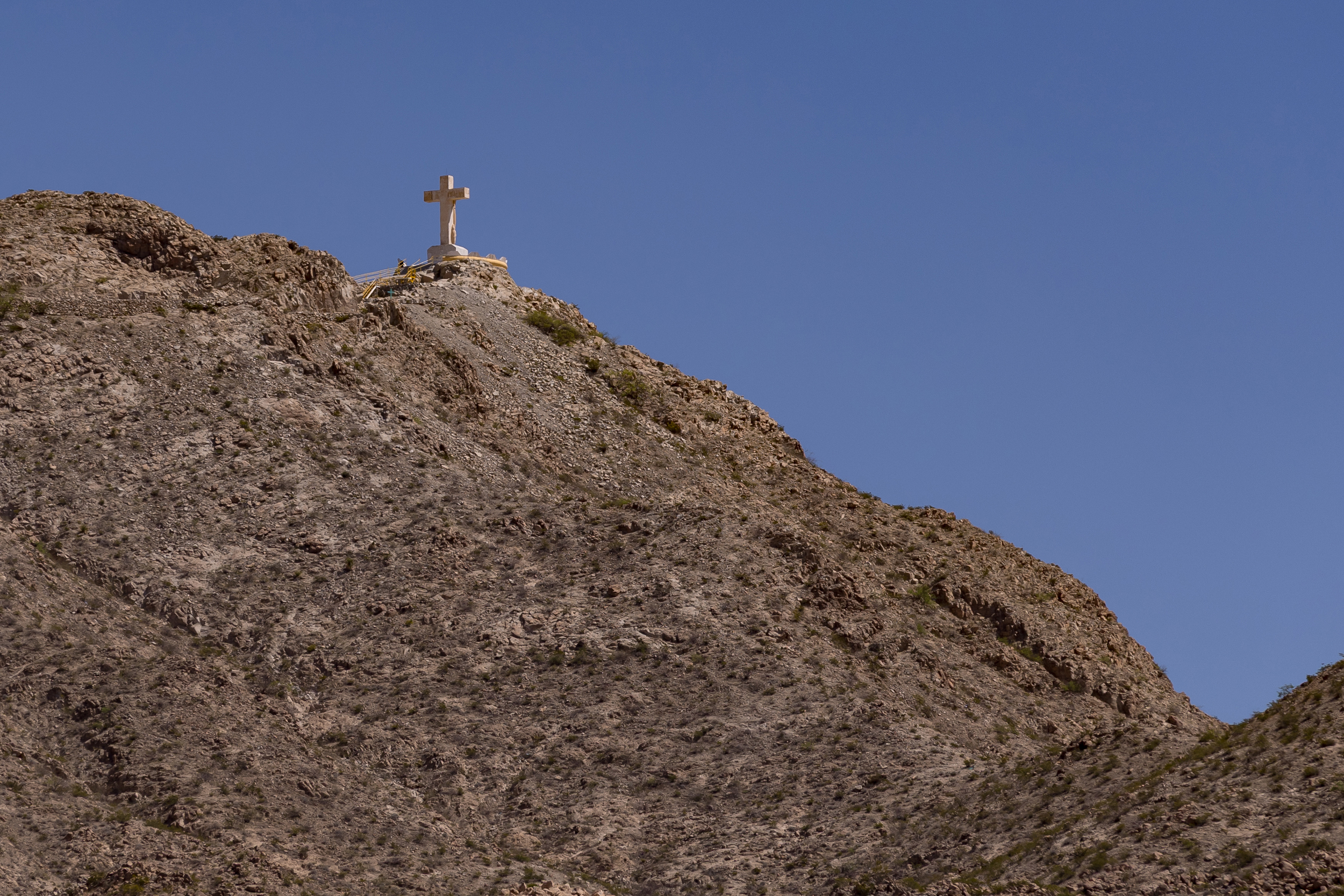 The Mount Cristo Rey monument sits atop a hill overlooking the U.S.-Mexico border wall near Sunland Park, N.M. Credit: Gaby Velasquez/Puente News Collaborative