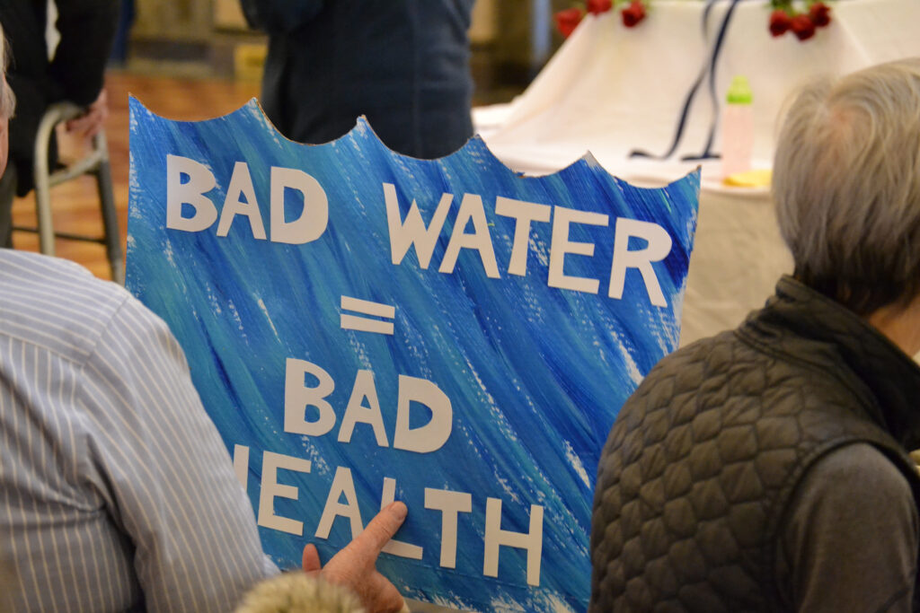 An “Our Water, Our Health!” rally at the Iowa State Capitol in February included a vigil for loved ones lost to cancer. Credit: Anika Jane Beamer/Inside Climate News