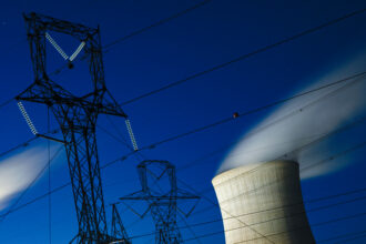 Power lines run in front of the coal-fired James H. Miller Jr. Electric Generating Plant in Adamsville, Ala. Credit: Andrew Caballero-Reynolds/AFP via Getty Images