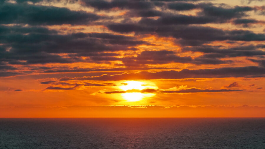 The sun sets over the Arctic Ocean near the North Cape in Norway. Credit: Soeren Stache/picture alliance via Getty Images