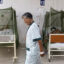 A dengue fever patient walks inside the Sergio Bernales National Hospital in the outskirts of Lima, Peru, on April 17, 2024. Credit: Juan Carlos Cisneros/AFP via Getty Images